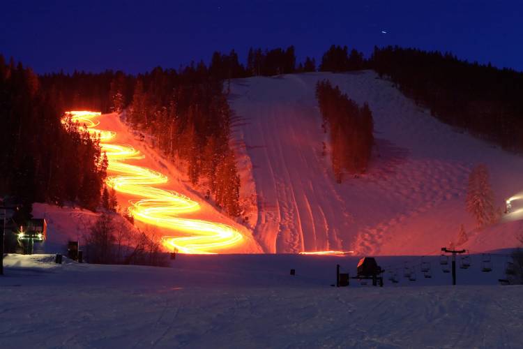 time lapse of lights up a ski mountain